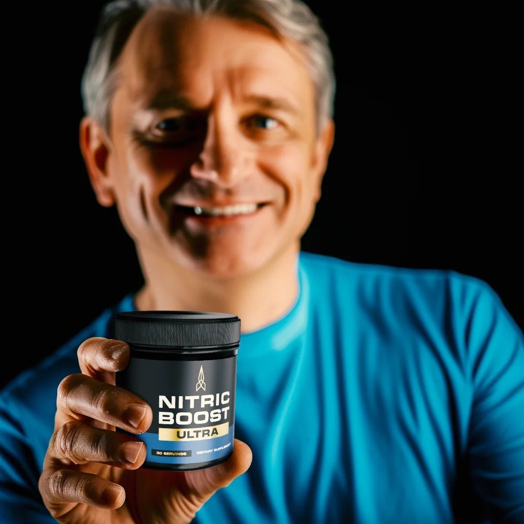 A man holding a jar of Nitric Boost Ultra nitric oxide powder
